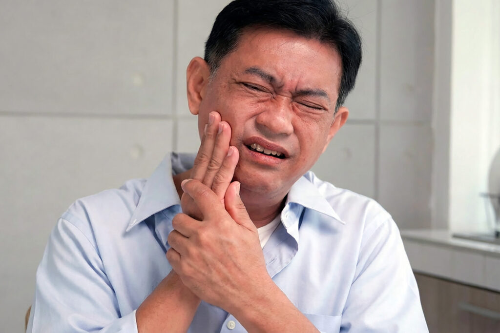 wisdom tooth pain symptoms