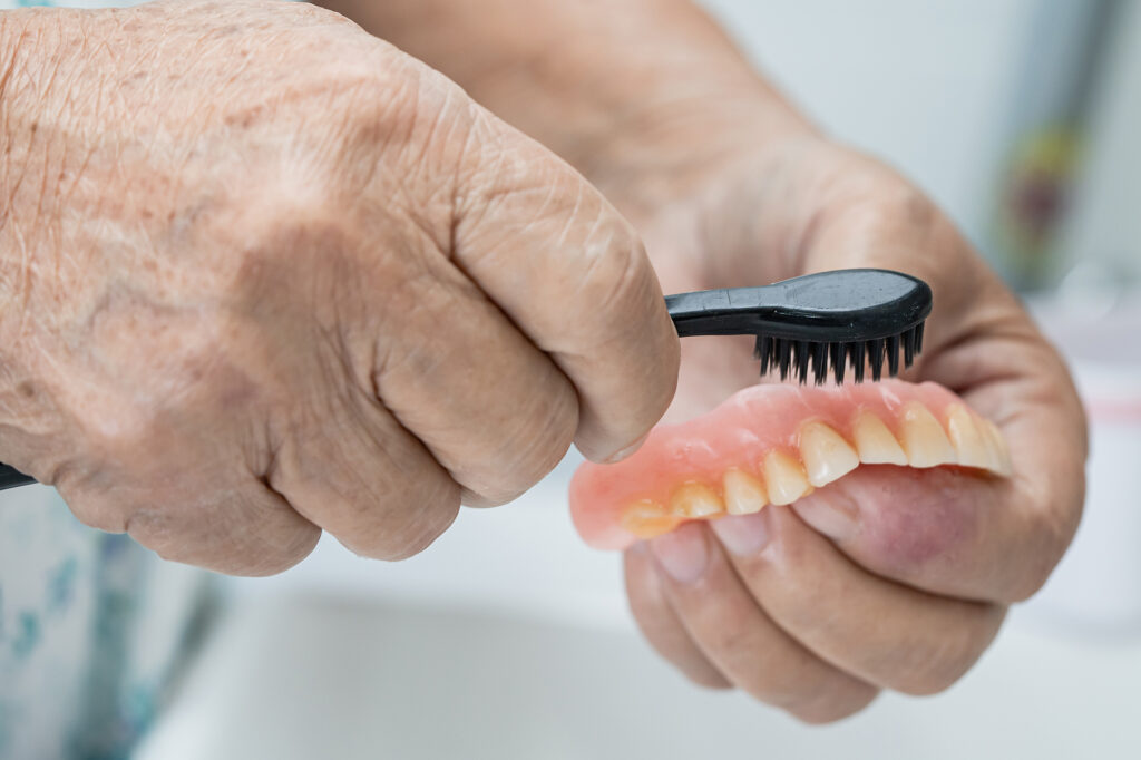 dentures vs implants Singapore